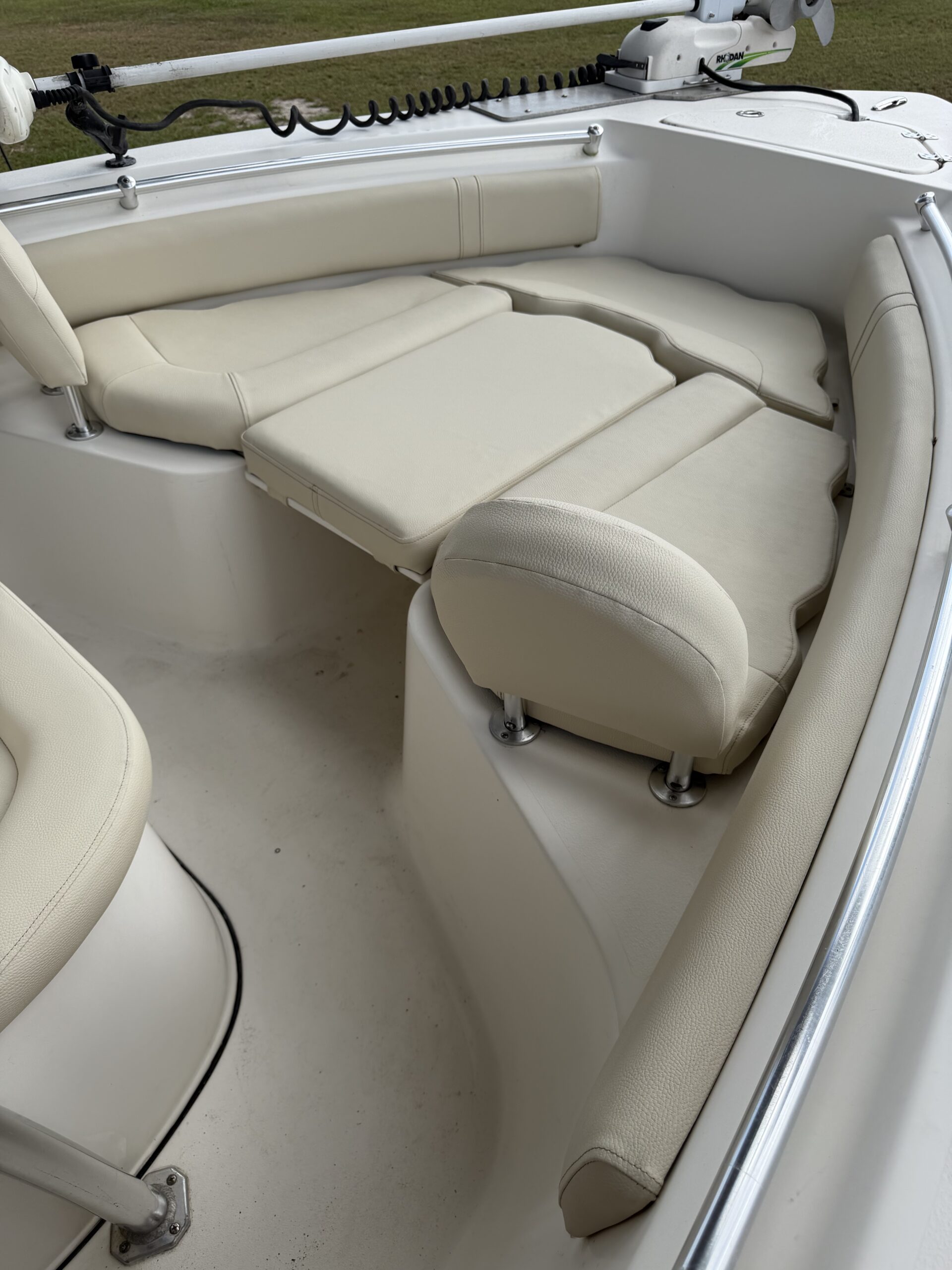 Bow casting deck cushions and coaming bolsters reupholstered in cream marine vinyl