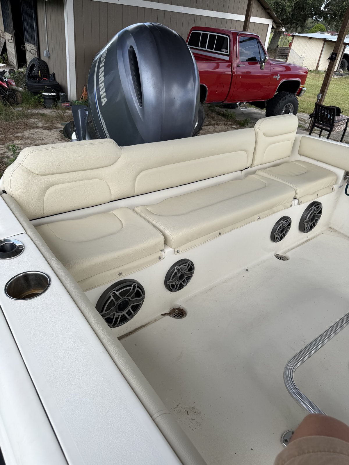 Stern seating reupholstered in cream marine vinyl with matching backrests
